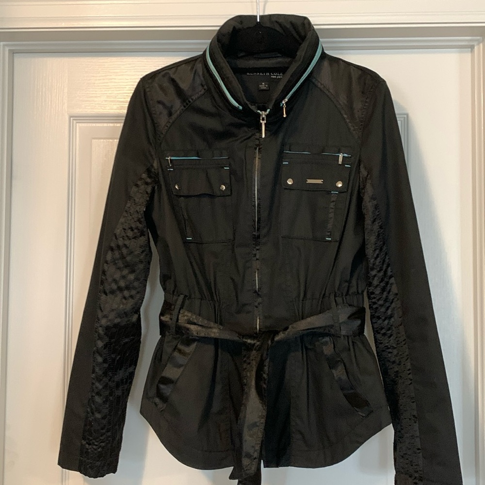 Kenneth Cole peplum style trench with black satin accents with pop of teal